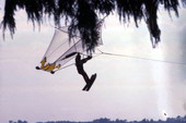 View showing an employee parakiting at the Cypress Gardens theme park in Winter Haven, Florida.