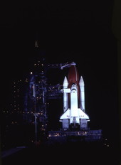 Space shuttle on launch site at the Kennedy Space Center.
