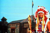 Man in Native American costume at the Fort Liberty dinner show attraction in Kissimmee, Florida.