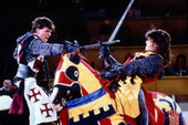 Men sword fighting at the Medieval Times Dinner and Tournament attraction in Kissimmee, Florida.