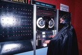 Employee at the controls of a machine at the Mystery Fun House attraction in Orlando, Florida.