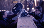 View showing Florida Department of Commerce film crew members with a camera.