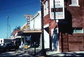 View showing the Cawthon State Bank and Service Drug Company store on Baldwin Avenue in DeFuniak Springs, Florida.