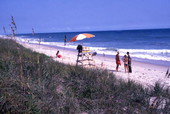 Lifeguard with people at the Canaveral National Seashore beach in Brevard County near Titusville, Florida.