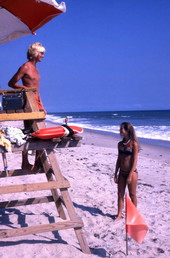 Girl speaking with lifeguard at the Canaveral National Seashore beach in Brevard County near Titusville, Florida.