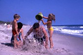 Family having fun at the Canaveral National Seashore beach in Brevard County near Titusville, Florida.