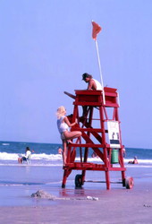 Lifeguard speaking with visitor at Daytona Beach.