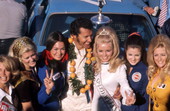 Richard Petty and his 43 car with women in the winner's circle following the Daytona 500 auto race.