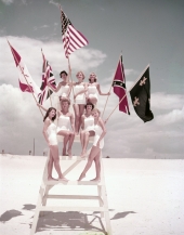 Miss Fiesta contestants posing on lifeguard stand during the Fiesta of Five Flags in Pensacola.