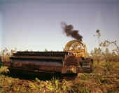 Close-up view showing a forestry drum chopper roller preparing Buckeye Cellulose Corporation land in Perry.