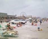 Crowded beach scene of people and automobiles - Jacksonville, Florida
