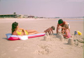 Family building a sand castle at the beach - Jacksonville, Florida
