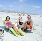 Man with two women lying in the sun at the beach - Little Talbot Island, Florida
