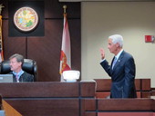 Former Governor Charlie Crist taking the oath before testifying in the trial of former House Speaker Ray Sansom.