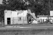 Aluminum siding building damaged by Hurricane Ivan - Navarre, Florida.