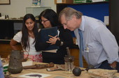 Representatives from the Governor's Office of Policy and Budget (OPB) viewing objects during their visit to the Department of State's Archaeology Conservation lab.