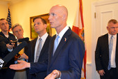 Governor Rick Scott speaking to reporters in Tallahassee about a legislative bill for college students.