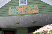 Close-up view of Hole in the Wall Seafood restaurant & raw bar at 23 Ave. D in the Apalachicola Historic District.