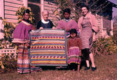 Photographer's wife Gladys posing with Deaconess Bedell and Seminole Indians at Glade Cross Mission in Everglades City.