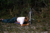 Photographer's husband Don taking a picture of a Box turtle in the Everglades.