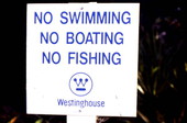 Westinghouse sign prohibiting activities in polluted waters.