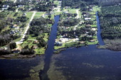 Aerial view over a section of New Smyrna Beach showing dredged canals - Volusia County, Florida