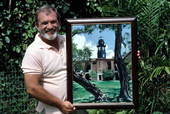 Artist George Carey displaying one of award winning paintings - Key West, Florida