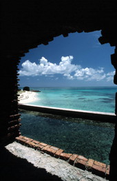 Looking out of Fort Jefferson across moat towards a small section of beach - Dry Tortugas, Florida
