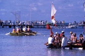 Participants of the first annual Key West Raft Race leaving Monroe Beach - Key West, Florida.
