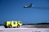 1988 Oshkosh P-19 CFR vehicle on alert stand-by, a.k.a. "Hot Spot", near mid-field at NASKW.