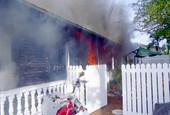 View of house fire on 1709 Flagler Ave. from the east side of the structure showing fire..