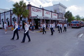 Members of the Key West Fire Dept. marching in "Island Roots Festival" parade on Duval St., Key West, FL..
