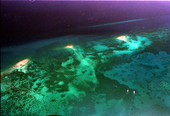 Shows Eastern Dry Rocks, left, and Sand Key Lighthouse, right, on the reef line off Key West and the Florida Keys..