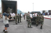 National Guard personnel distributing food supplies at the Key West High School during Hurricane Wilma relief efforts.