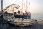 View of the schooner "Hindu" at dock with a dinghy in the foreground - Key West, Florida.