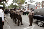 Honor Guard from Metro-Dade Police Department performing 21 gun salute during funeral for Key West police officer John Piskator - Key West, Florida.