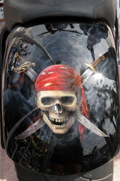 Pirate skull artwork on motorcycle fender displayed during Boardwalk Chopper and Custom Bike Show - Daytona Beach, Florida.