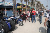 Crowds admiring motorcycles on display for the Boardwalk Chopper and Custom Bike Show during Bike Week - Daytona Beach, Florida