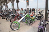 Motorcycles displayed on boardwalk for custom bike show during Bike Week - Daytona Beach, Florida.