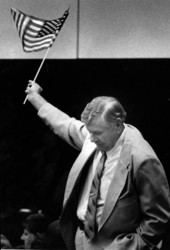 Representative Sid Martin waves an American flag during a debate - Tallahassee, Florida.
