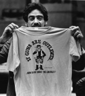 Rep. Michael Friedman, D-Miami Beach shows fellow lawmakers a T-shirt he brought back after lunch - Tallahassee, Florida.