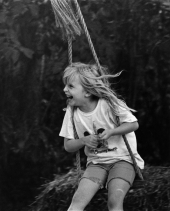 Leslie Dughi on the swing in her backyard on McDaniel Street - Tallahassee, Florida.