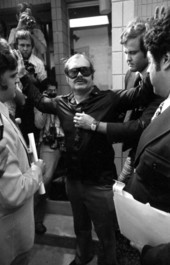 John William Clouser, once one of the FBI Ten Most Wanted Fugitives known as the "Florida Fox", surrendering to law enforcement officers.