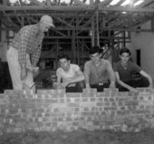 Boys laying brick in the construction of a building at the School for Boys in Marianna, Florida.