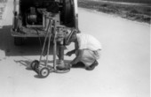 Unidentified man with a core drill rig .