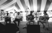 Lloyd Baldwin (fiddle), Dave Boreland (guitar), and Bill Martin (autoharp) with Marion Lasley on the Old Marble Stage- White Springs, Florida
