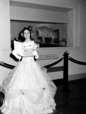 Rebecca Ann Jenkins reading from a Stephen Foster booklet at the Jeanie Diorama- White Springs, Florida