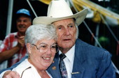 Bill Monroe with an unidentified woman at the Florida Folk Festival - White Springs, Florida .
