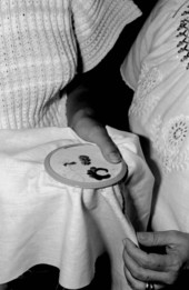 Holding an example of Hungarian embroidery- Winter Park, Florida