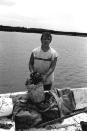 Mike Hilchey with sack and bucket of oysters collected from Simpson's Creek.- Jacksonville, Florida